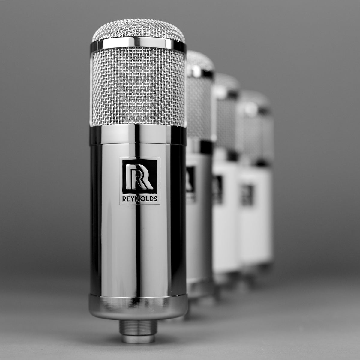A row of Reynolds valve microphones, the chrome RM1V in front